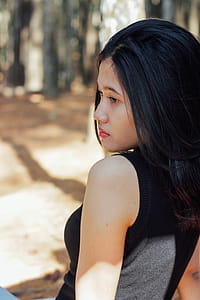 Woman Wearing Black Sleeveless Top thumbnail