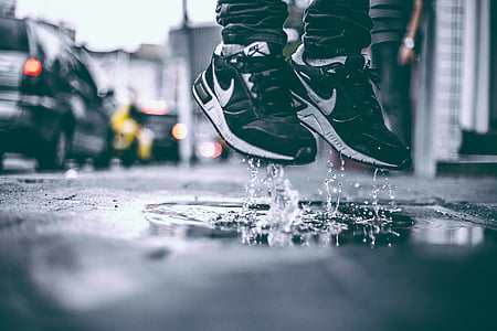 pair black-and-white Nike running shoes thumbnail