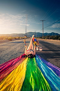 woman lying on asphalt road thumbnail