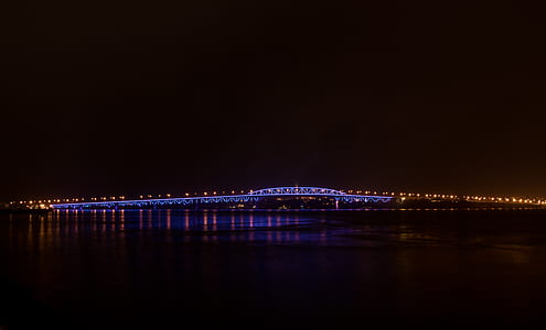 lighted bridge during nighttime thumbnail