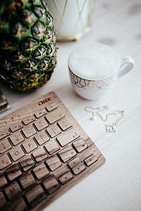 Wooden keyboard and cup of coffee thumbnail
