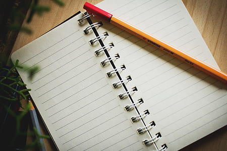 pencil on top of notebook thumbnail