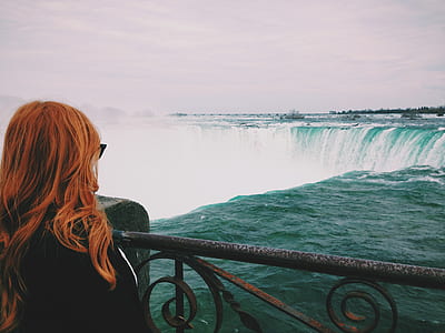 Woman Standing Near of Niagara Falls thumbnail