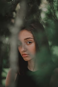 photography of woman near green leaf tree thumbnail