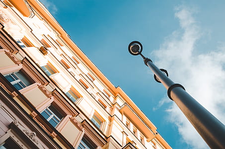 brown concrete building near black metal street pole thumbnail