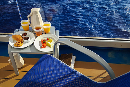 plates with table near body of water thumbnail