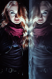 woman standing, wearing maroon scarf and black long-sleeve shirt thumbnail