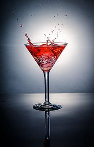 clear glass martini glass with red liquid thumbnail