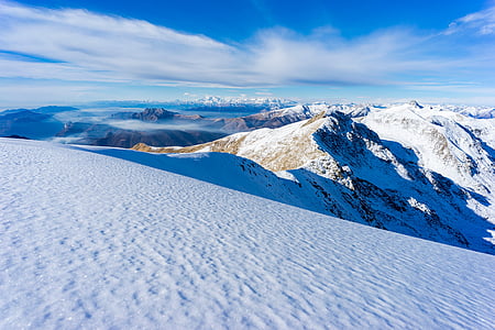 aerial view of mountains covered with snow during daytime thumbnail