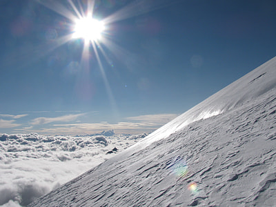 aerial view of snow glaciers under sunny sky thumbnail