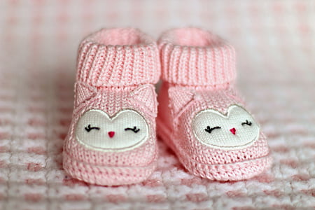 shallow focus photography of pair of baby's pink knitted shoes thumbnail