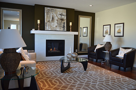 photo of two candle sticks at the top of white wooden fire place thumbnail