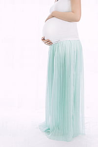 pregnant woman holding her stomach thumbnail