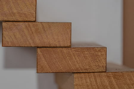 close-up photo of pile of brown planks thumbnail