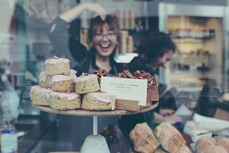 woman posing in front of cupcakes thumbnail