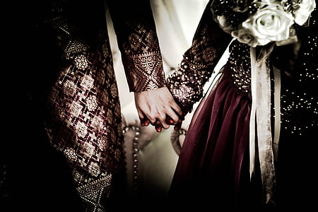 newly wed couple holding hands thumbnail