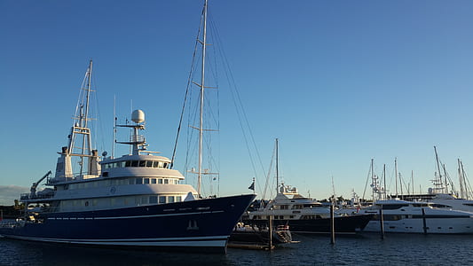 white and black ship under blue sky thumbnail