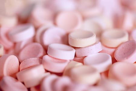 shallow focus photo of pink capsules thumbnail