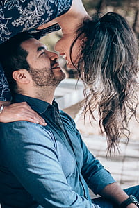 woman standing behind man thumbnail