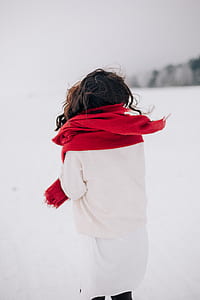 Woman Wearing White Long-sleeved Shirt Standing on Snow thumbnail