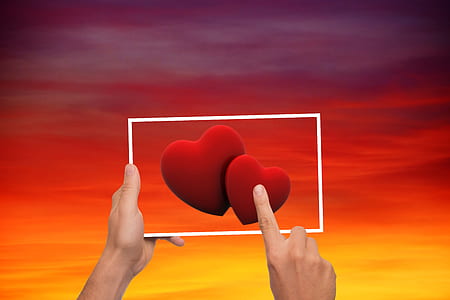 person touching two red hearts illustration thumbnail