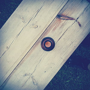 round black bottle on two panel boards thumbnail