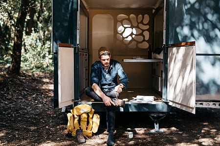 man seating on trailer thumbnail
