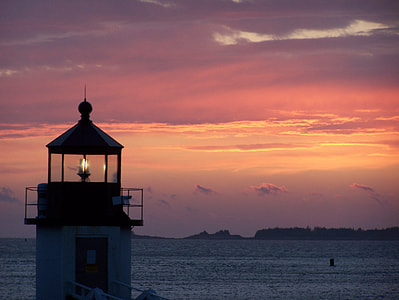 white and black lighthouse sunset thumbnail