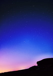 silhouette photo of rock formation under sky thumbnail