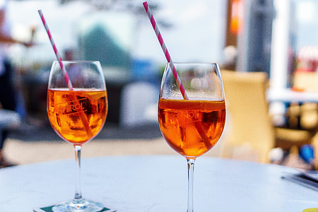 two brown liquor filled glass goblets thumbnail