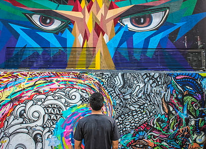 man watching the mural art thumbnail