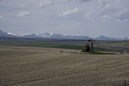 Farm Machinery with mountains in the background in Montana thumbnail