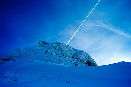 snow-capped mountain under sky thumbnail