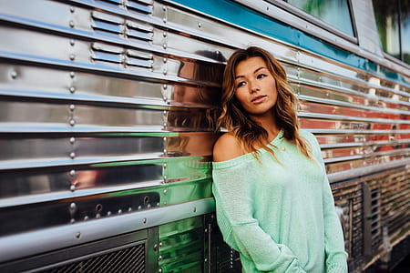 woman in blue long-sleeved top thumbnail