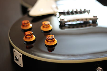 close-up photo of black electric guitar thumbnail