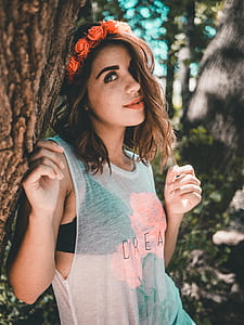 woman beside tree posing for photo thumbnail