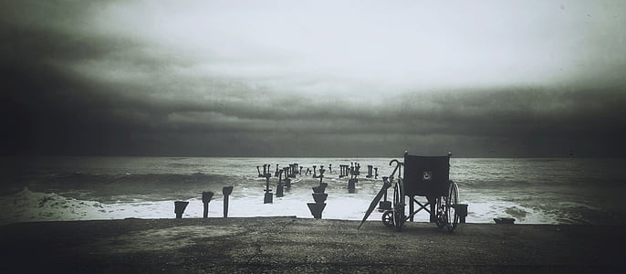 wheel chair near on the seashore thumbnail