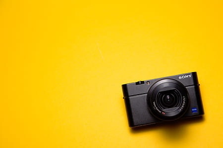 flat lay photography of black Sony compact camera thumbnail