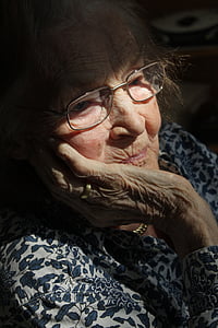 woman wearing eyeglasses looking down thumbnail