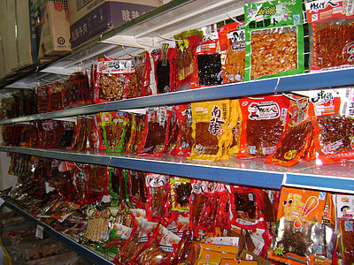 assorted-color food pack in white gondola shelves thumbnail