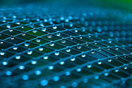 selective focus photo of teardrop on mesh fence thumbnail