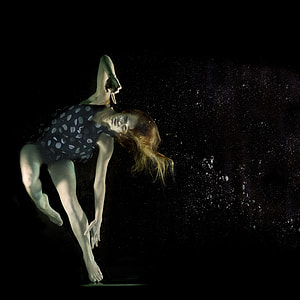 shallow focus photography of a woman under the body of water thumbnail
