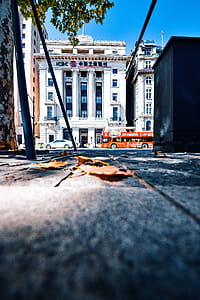 Car Parked In Front Of White Concrete Building thumbnail