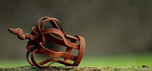 selective focus photography of brown metal accessory on ground thumbnail