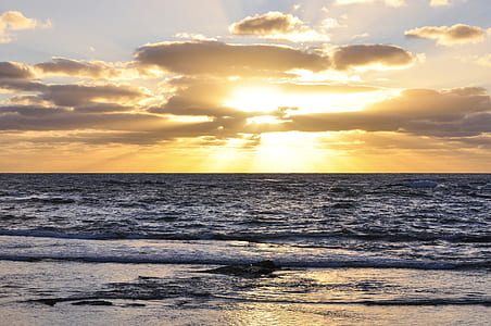 body of water during sunset thumbnail