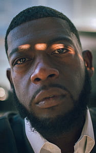 man in white collared top thumbnail