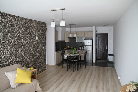 rectangular black table with chairs near brown sofa thumbnail