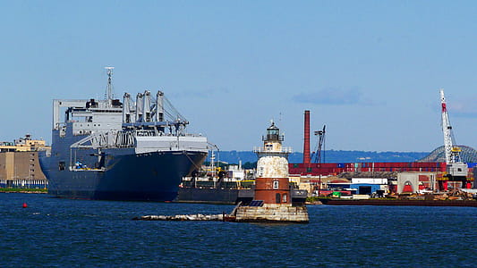 Upper New York Bay Lighthouses in New York harbor with Bayonne shipyard in the background. thumbnail