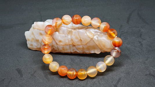 beaded multicolored bracelet on beige stone thumbnail