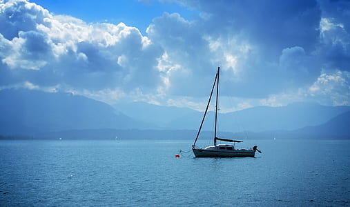 gray and white boat on sea during daytime thumbnail